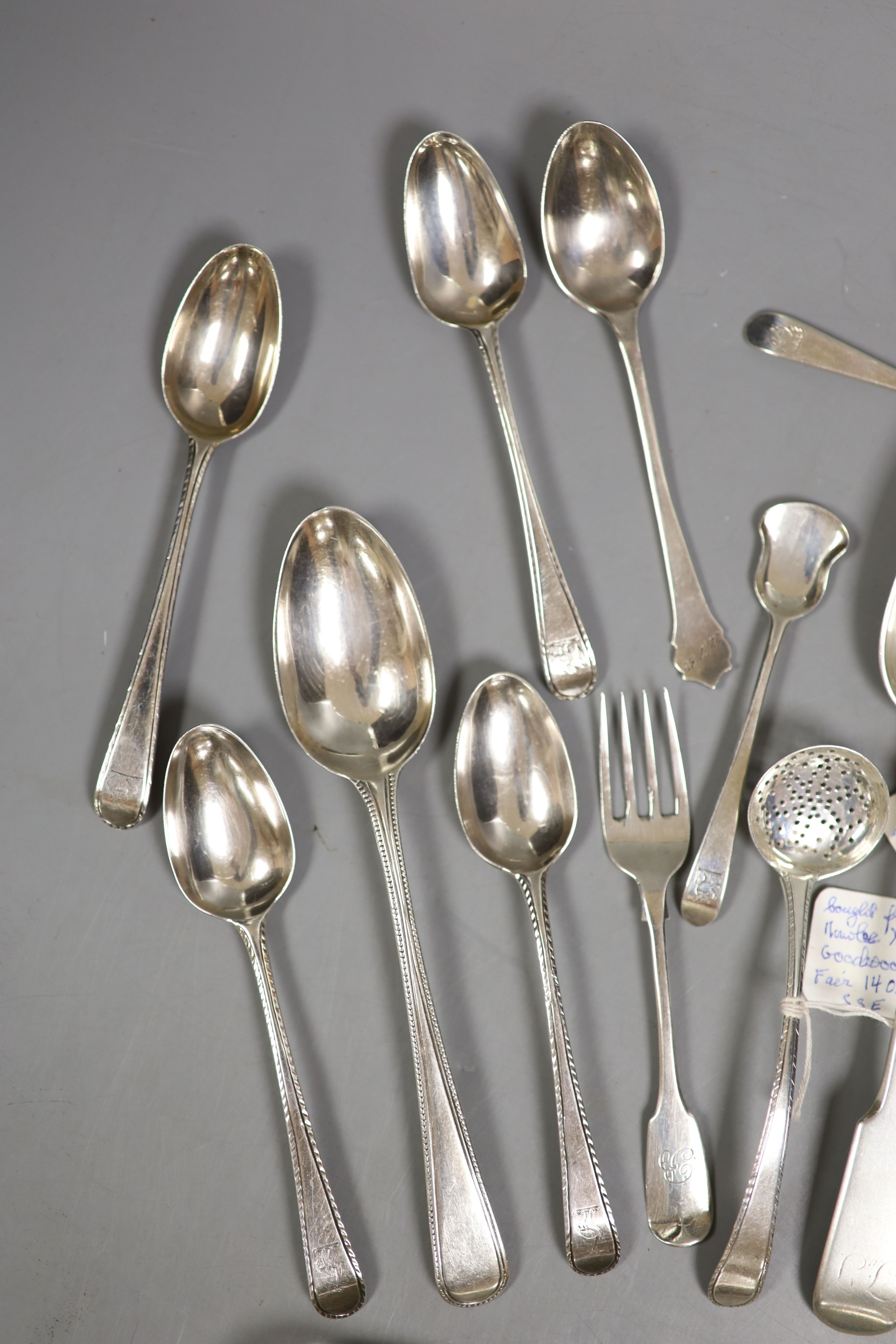 A small quantity of assorted mainly 19th century and later silver flatware including teaspoons, dessert spoon, sugar tongs, butter knife sifter spoon etc. various date and makers, 13.5oz.